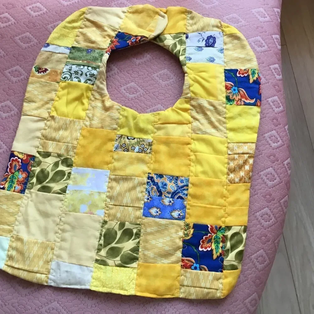 3/$25 or $12 each.  Hand Crafted, Quilted Yellow Reversible Baby Bib